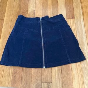 Navy blue front zip up skirt.